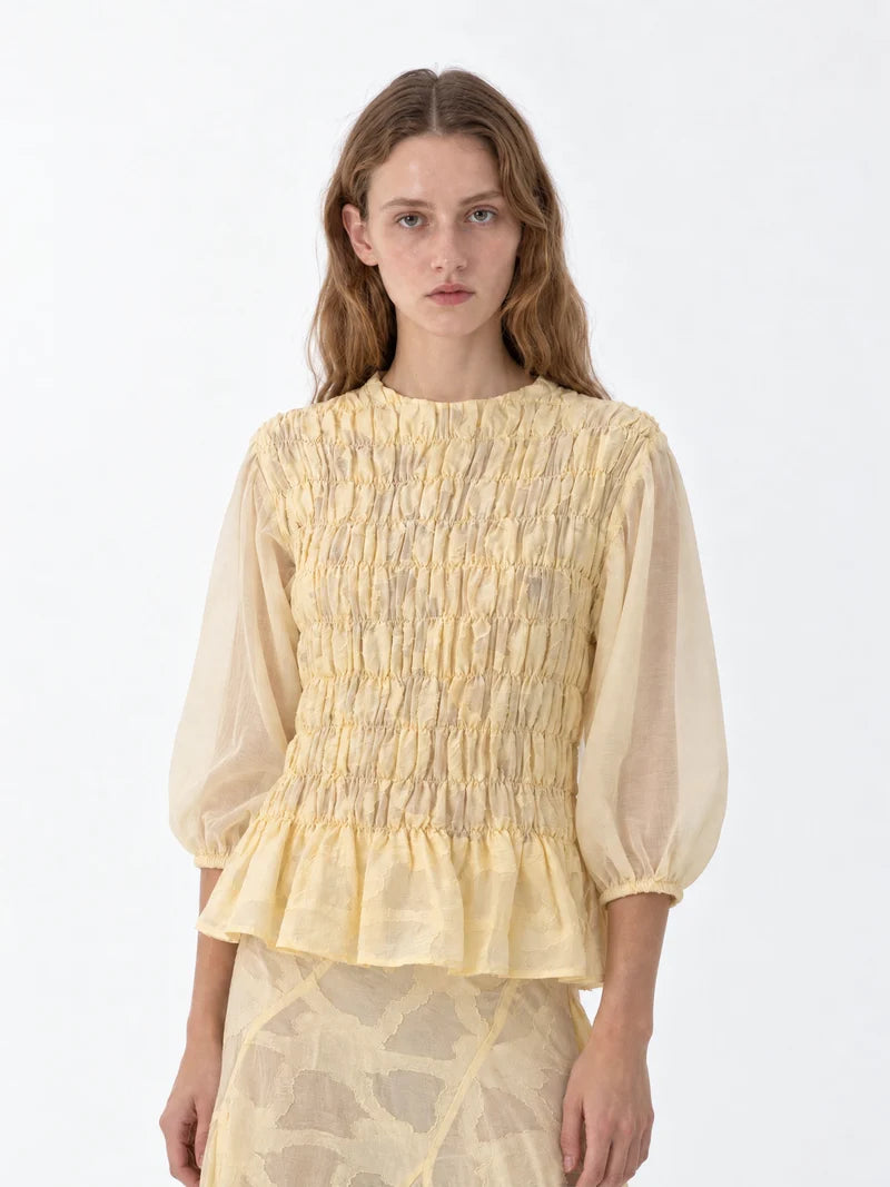 BUTTER AUTOMNE SMOCKED PEPLUM BLOUSE